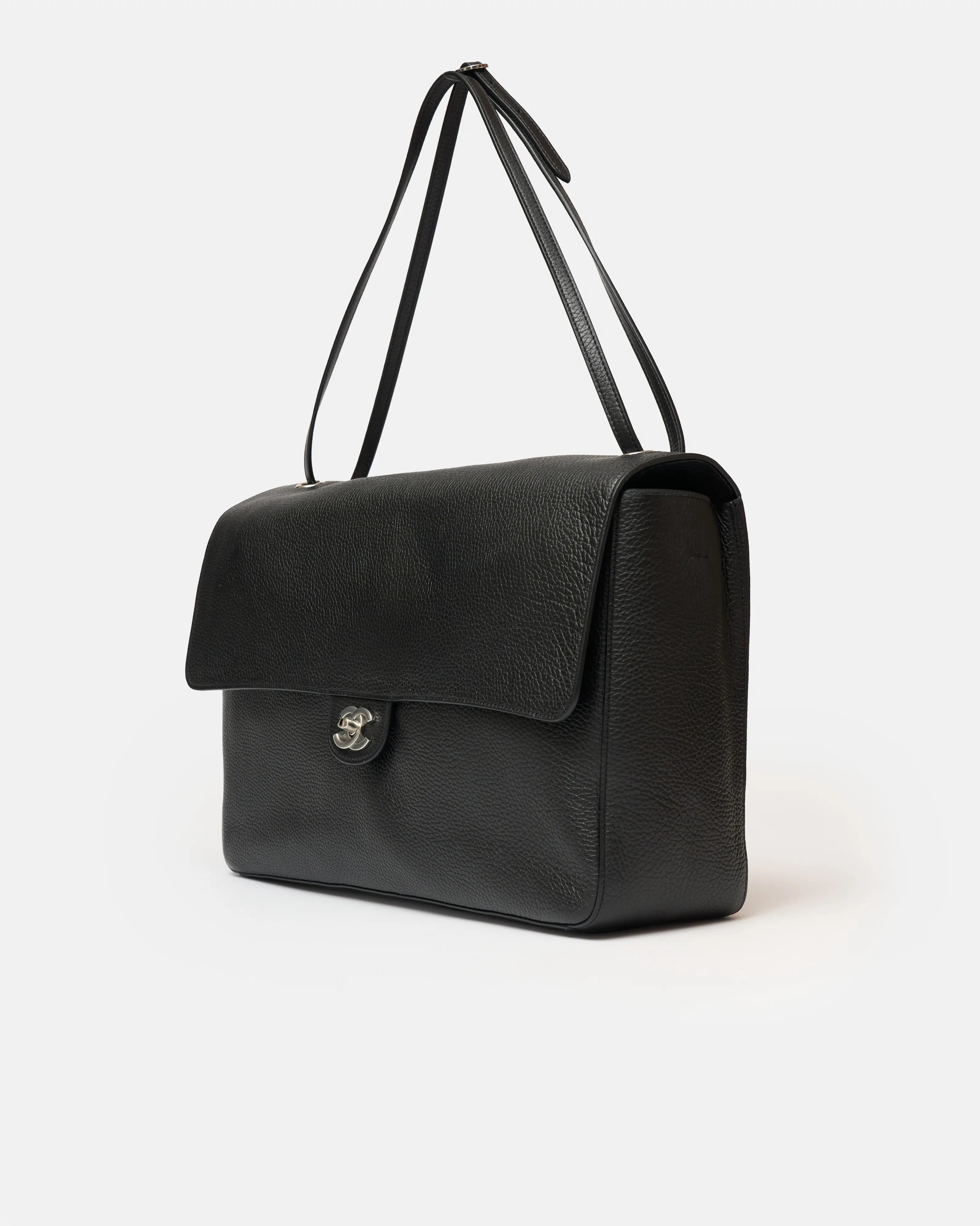 Chanel maxi flap shoulder bag in black color and grained calfskin material in PHW 