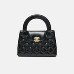 Chanel Mini Kelly crossbody bag in black color and Calfskin leather in GHW