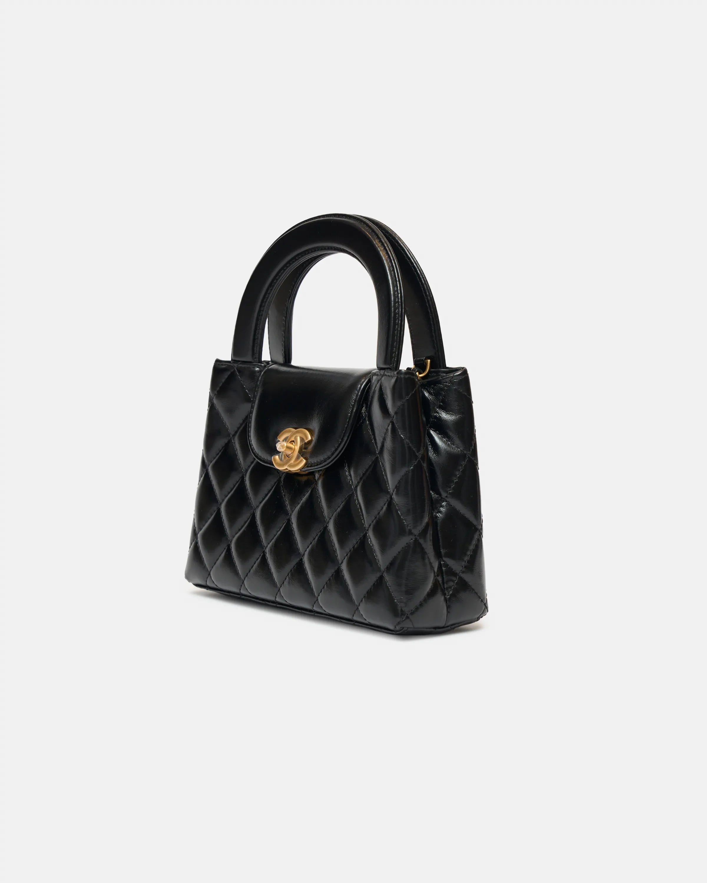 Chanel Mini Kelly crossbody bag in black color and Calfskin leather in GHW