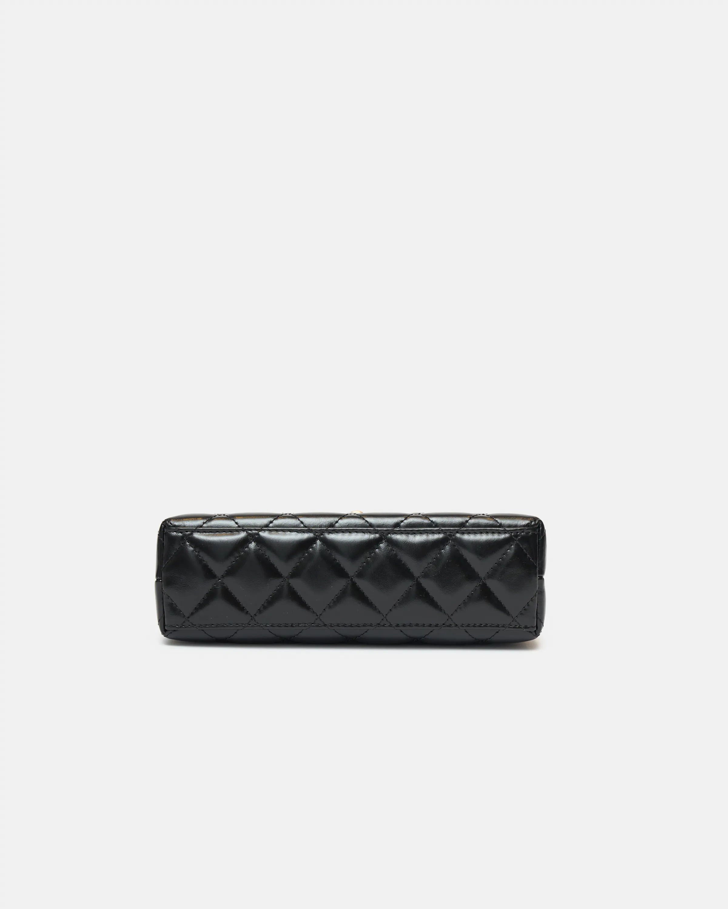 Chanel Mini Kelly crossbody bag in black color and Calfskin leather in GHW