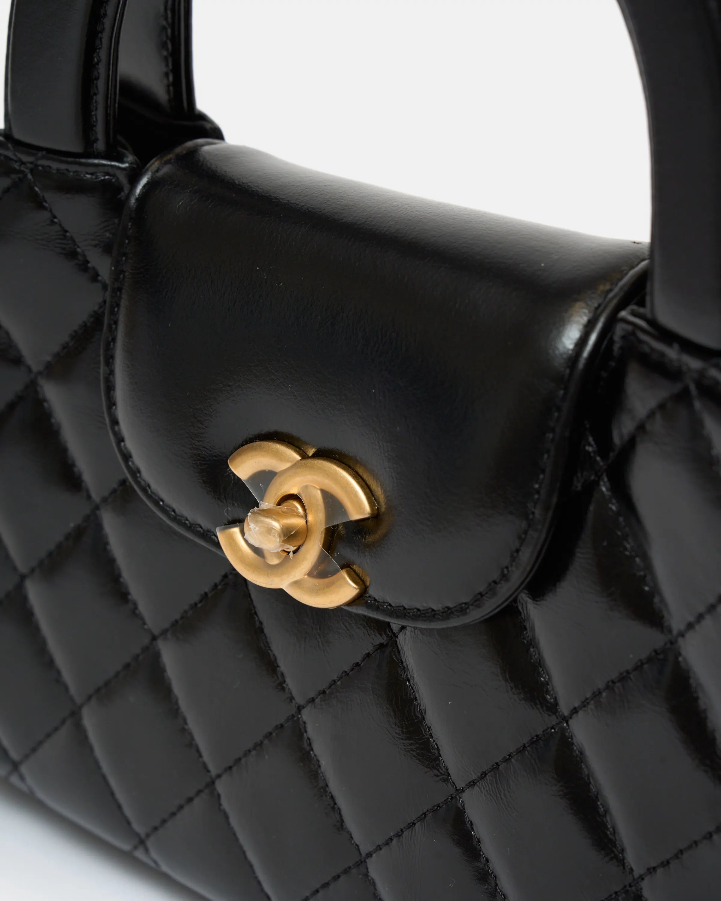 Chanel Mini Kelly crossbody bag in black color and Calfskin leather in GHW