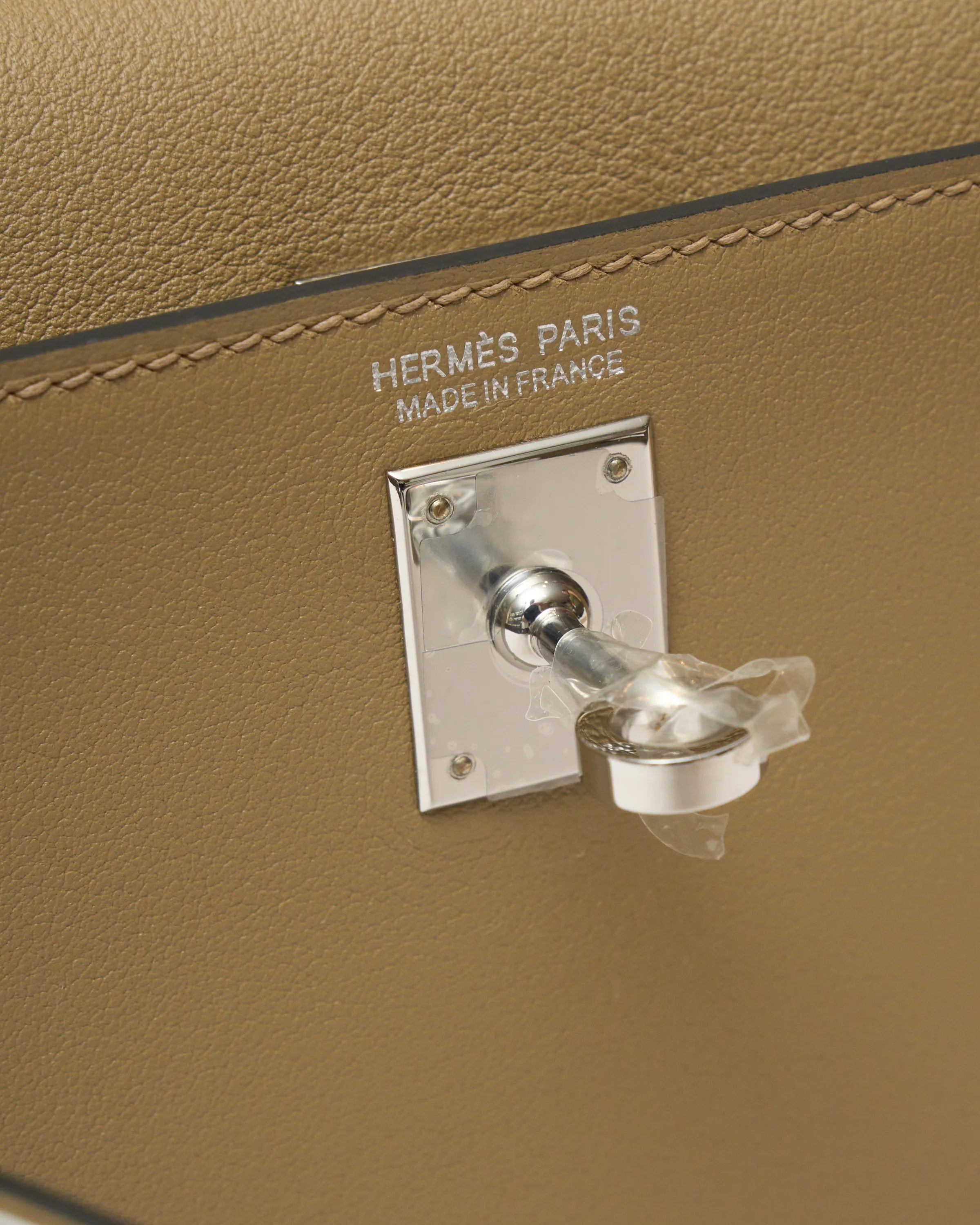 Hermès kelly danse crossbody in trench color and Swift leather in PHW