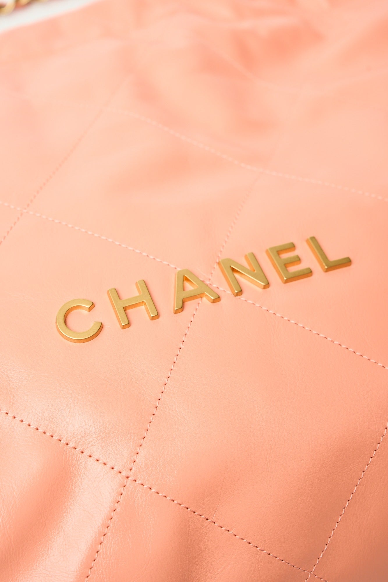 Chanel 22 Light Orange Lambskin Gold-Tone Metal
